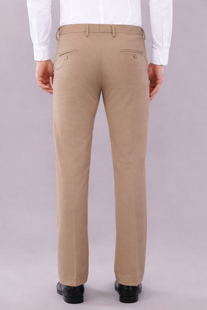 beige color stretchable pants worn by men with white color shirt