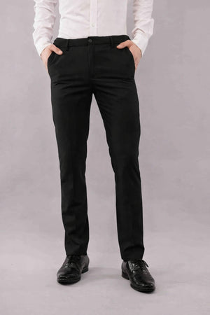 Person wearing a white shirt and black formal pants 