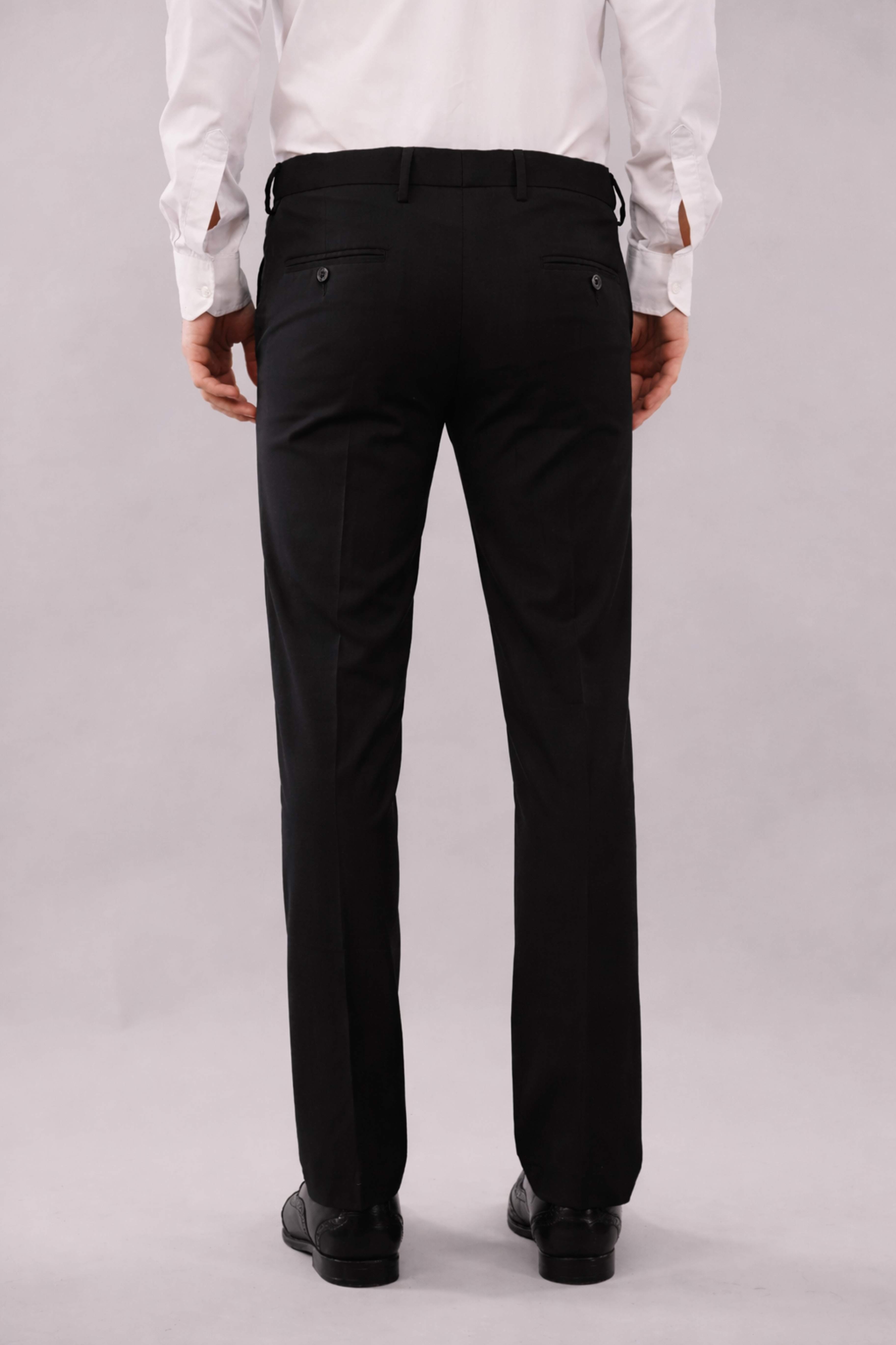 Person wearing black stretchable pants and a white shirt