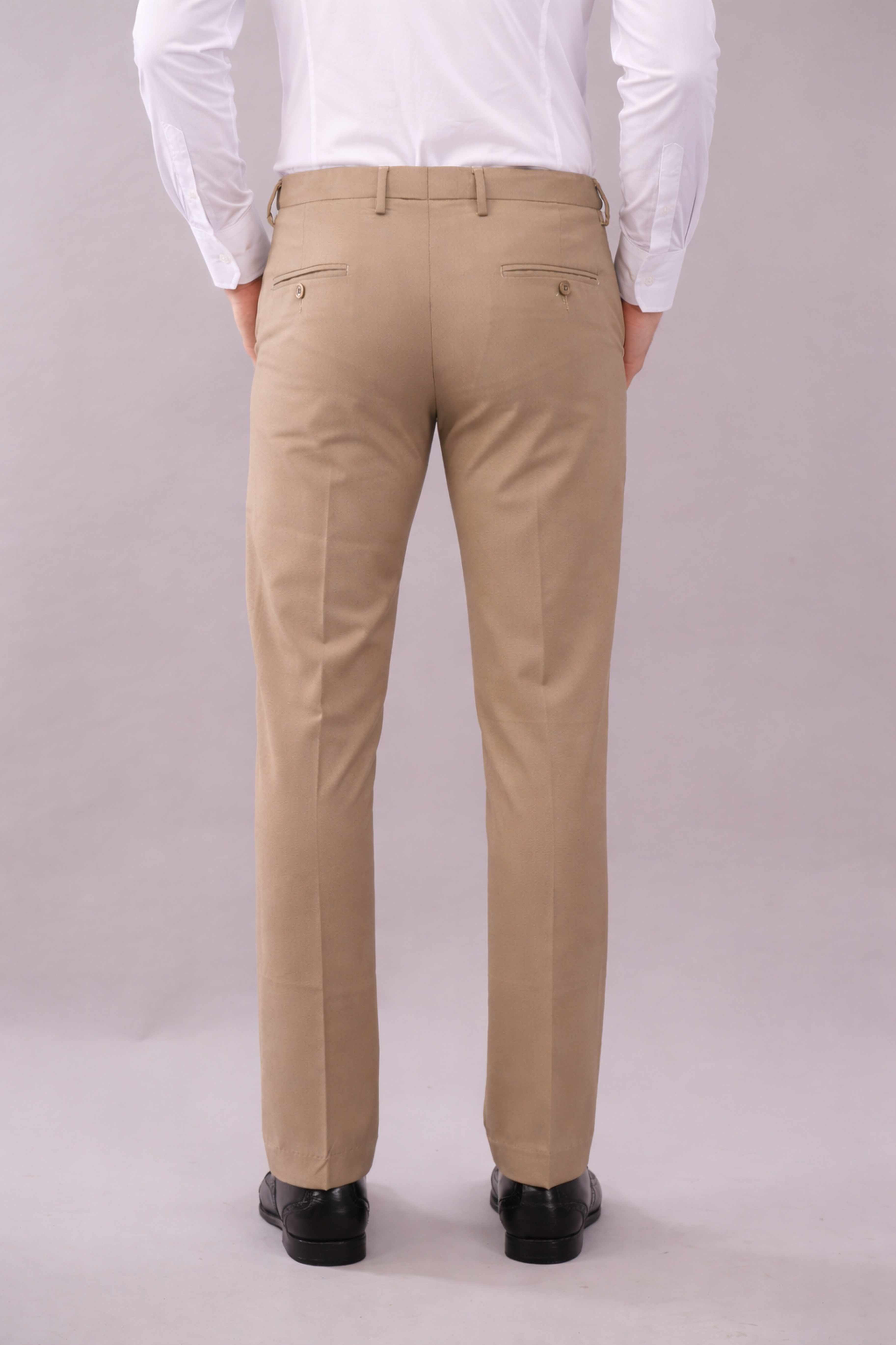 Person wearing flexi waist beige pants and a white shirt